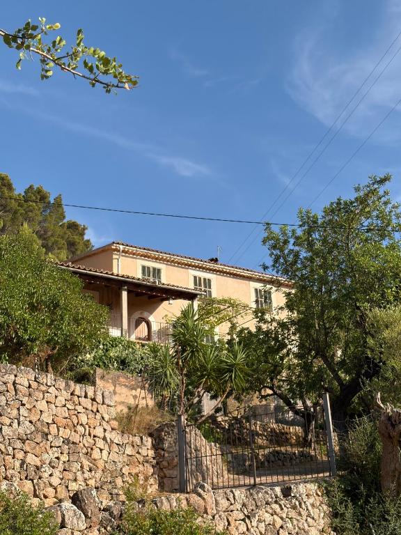 a house on top of a stone wall at Tramuntana Sunset in Port de Soller