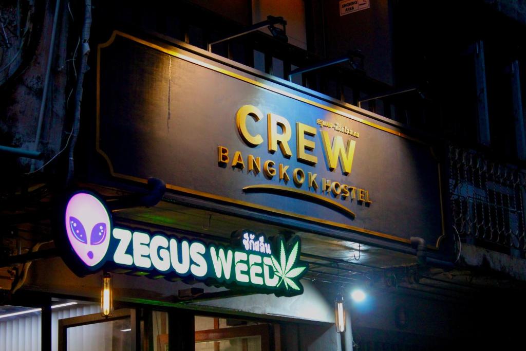 a sign on the side of a building at Crew Bangkok Hostel in Bangkok