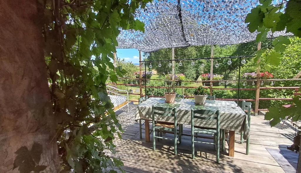 a table and chairs sitting on a patio at La Maillitardaise - Table d'Hôte in Saint-Pierre-de-Fursac