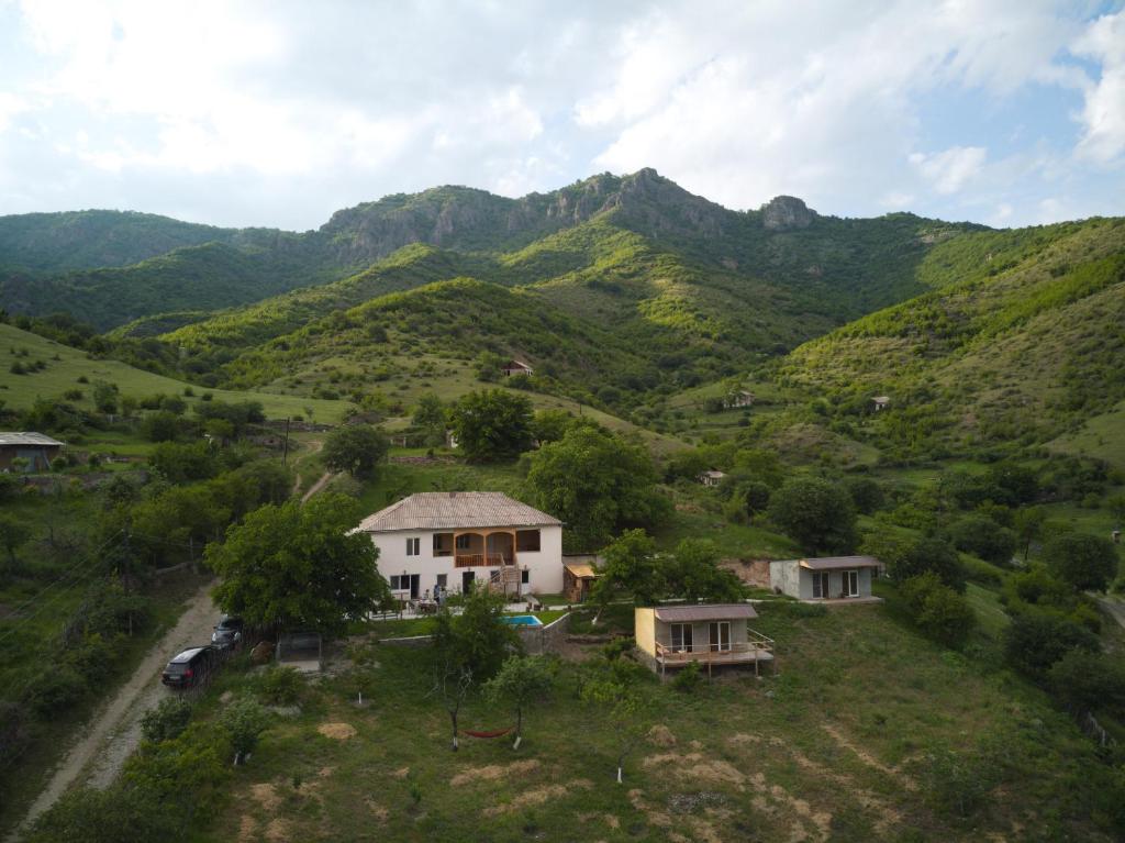 an aerial view of a mountain with a house at Cypress guesthouse in Pokr Ayrum