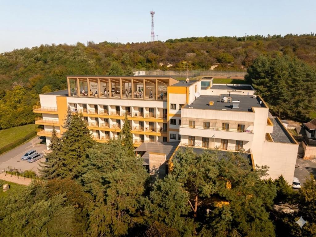 an overhead view of a large building with trees at Hotel Jantar Dudince in Dudince