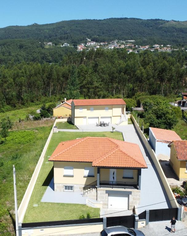 an aerial view of a house with an orange roof at Casa Fronteiriça - 2 Casas com piscina privada in Valença