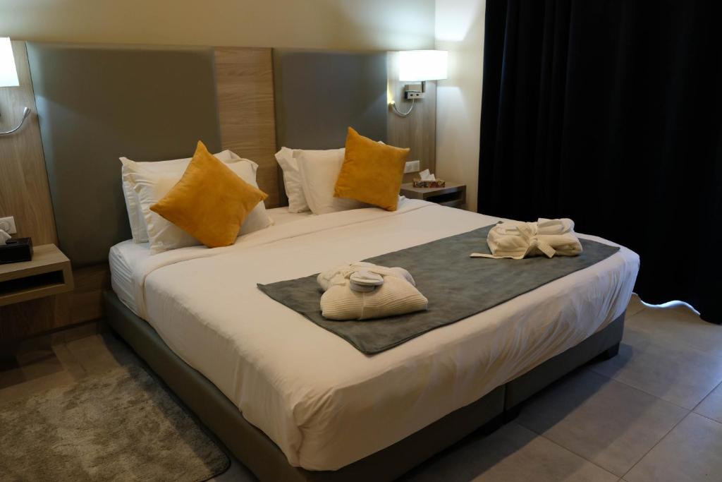 a hotel room with a bed with towels on it at EVASION by LIBERTE in Oran