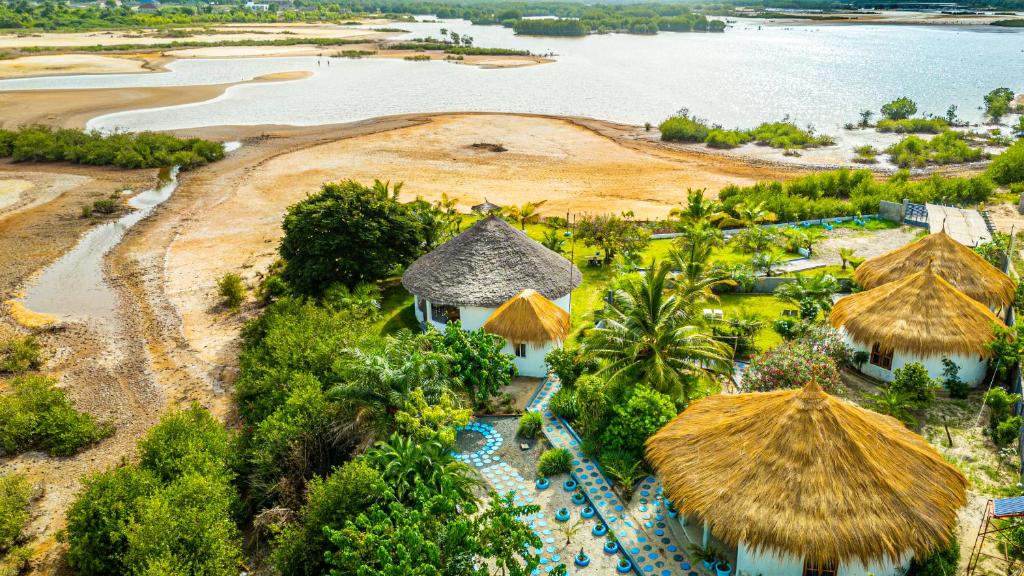 an aerial view of a resort with a beach at Tanema Creek in Brufut