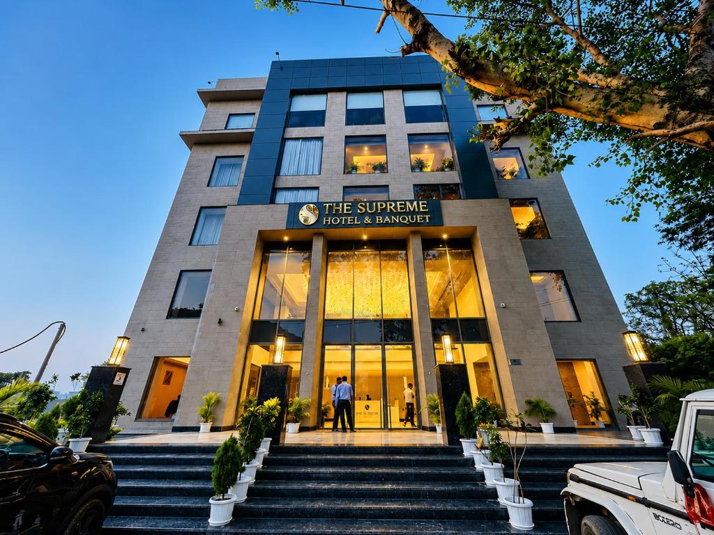 a man standing in front of a building at The Supreme Hotel and Banquet in Gaya