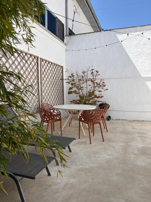 a patio with a table and two chairs at Selbaondoa, Casa con Patio en el Prepirineo Navarro in Lumbier