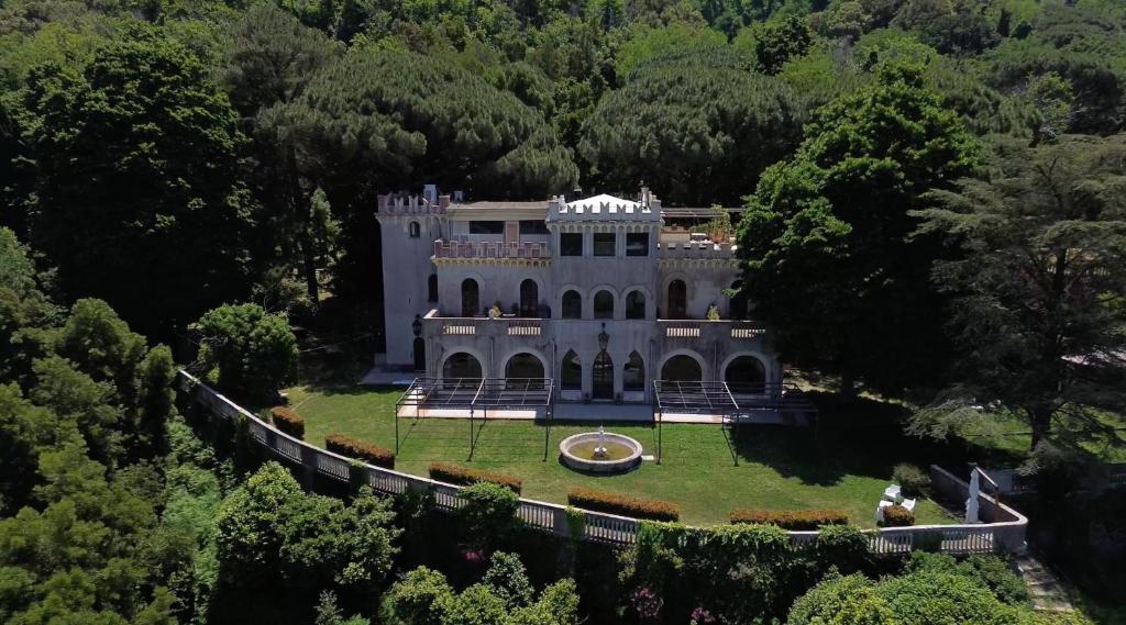 an aerial view of a mansion in the woods at Villa Borgo Musolino in Messina