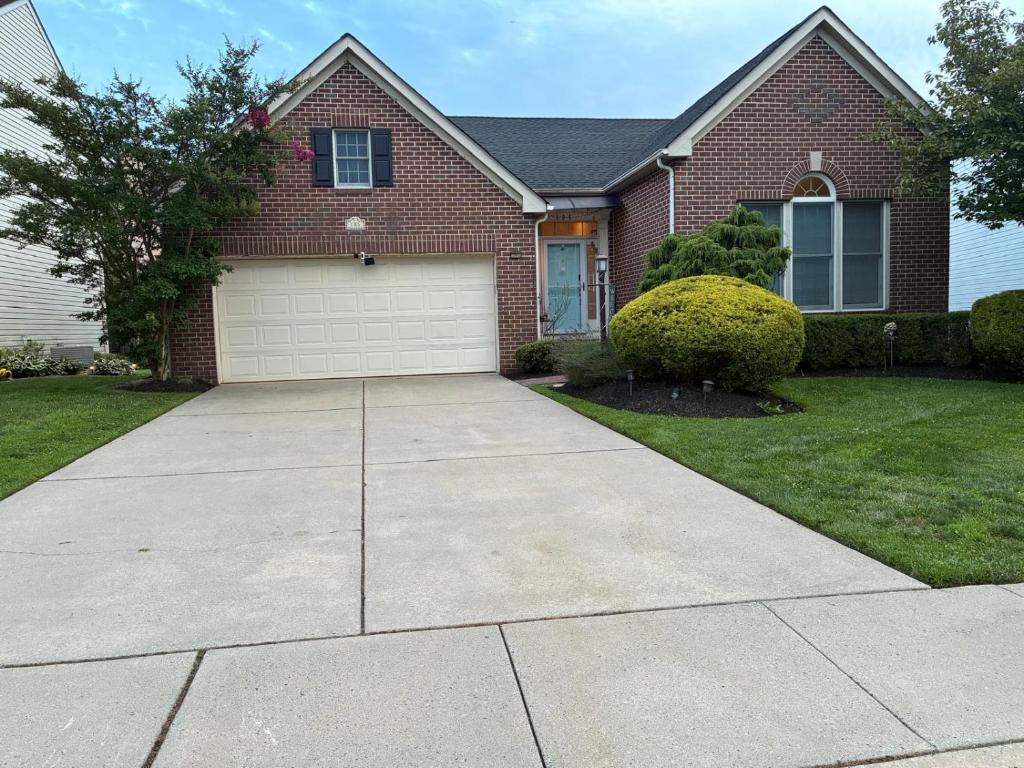 a house with a driveway in front of it at 5BRwithBand&Piano setup Private Gym Theater&Entry at Cherry Hill in Cherry Hill