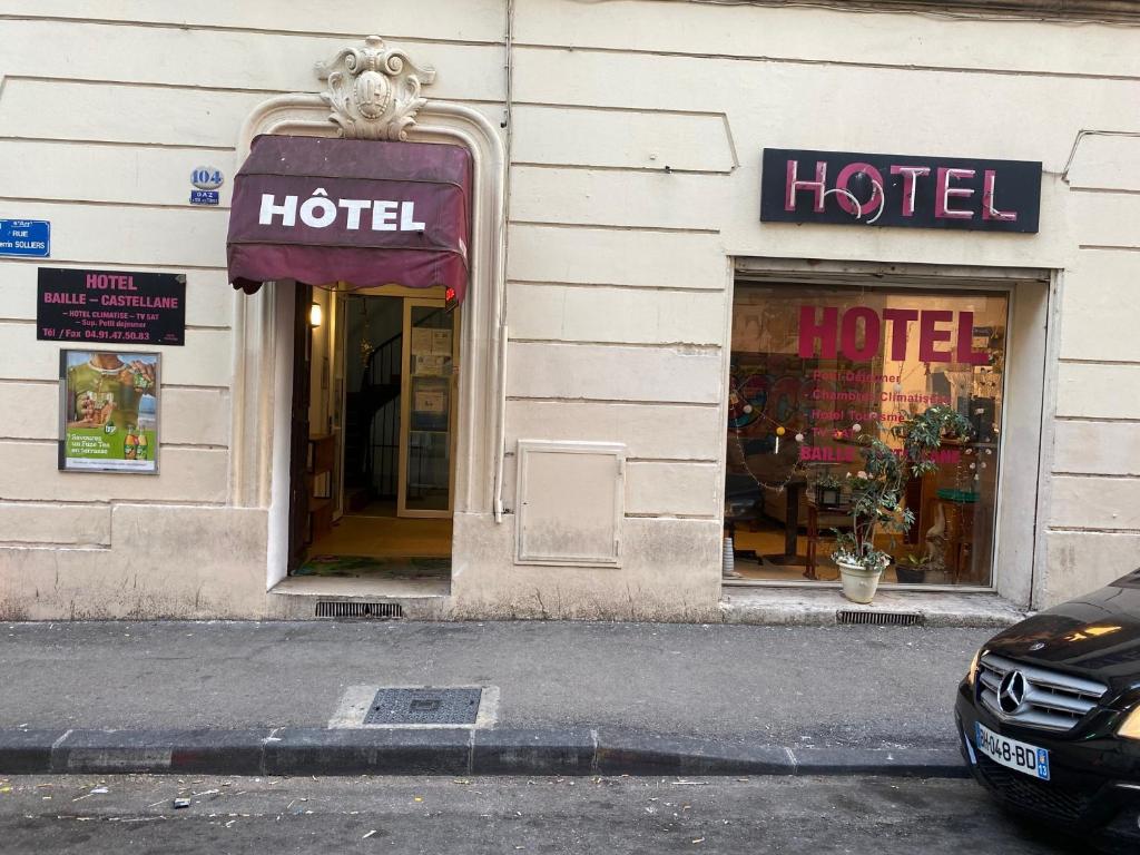 a hotel sign in the front of a building at Hotel baille castellane in Marseille