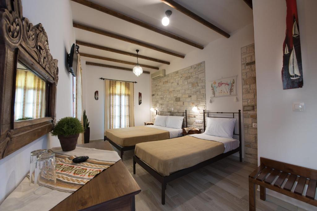 Postel nebo postele na pokoji v ubytování Cretan Villa Hotel