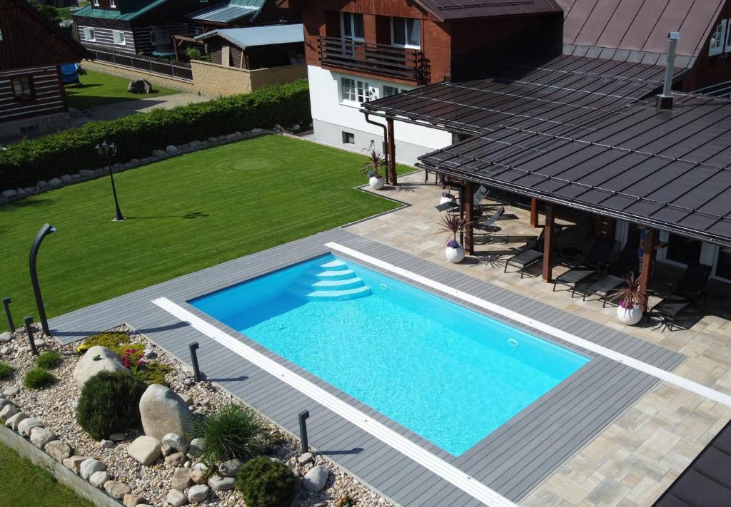 an overhead view of a swimming pool on a house at Chalet Schäfer s vyhřívaným bazénem se slanou vodou a saunou in Harrachov
