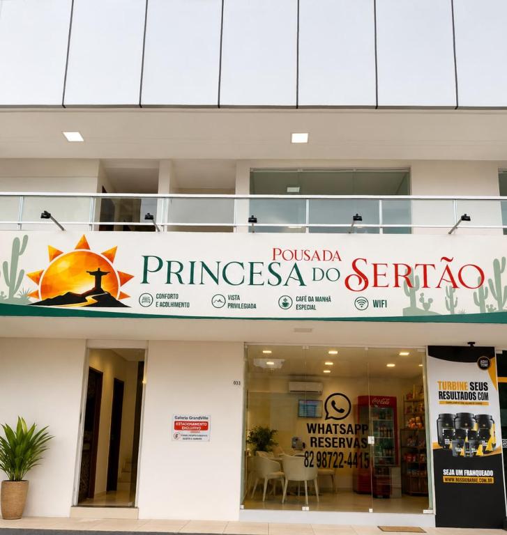 a building with a sign for a store at Princesa do Sertão Pousada in Palmeira dos Índios