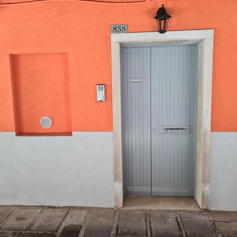 a gray door on the side of a building at VENEZIA BEACH e CHIOGGIA PLAYA in Chioggia