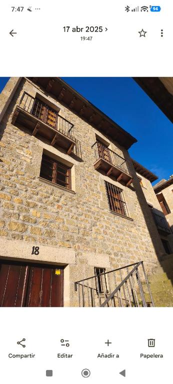 a picture of a brick building with windows at Casona de la Tauna in Sos del Rey Católico
