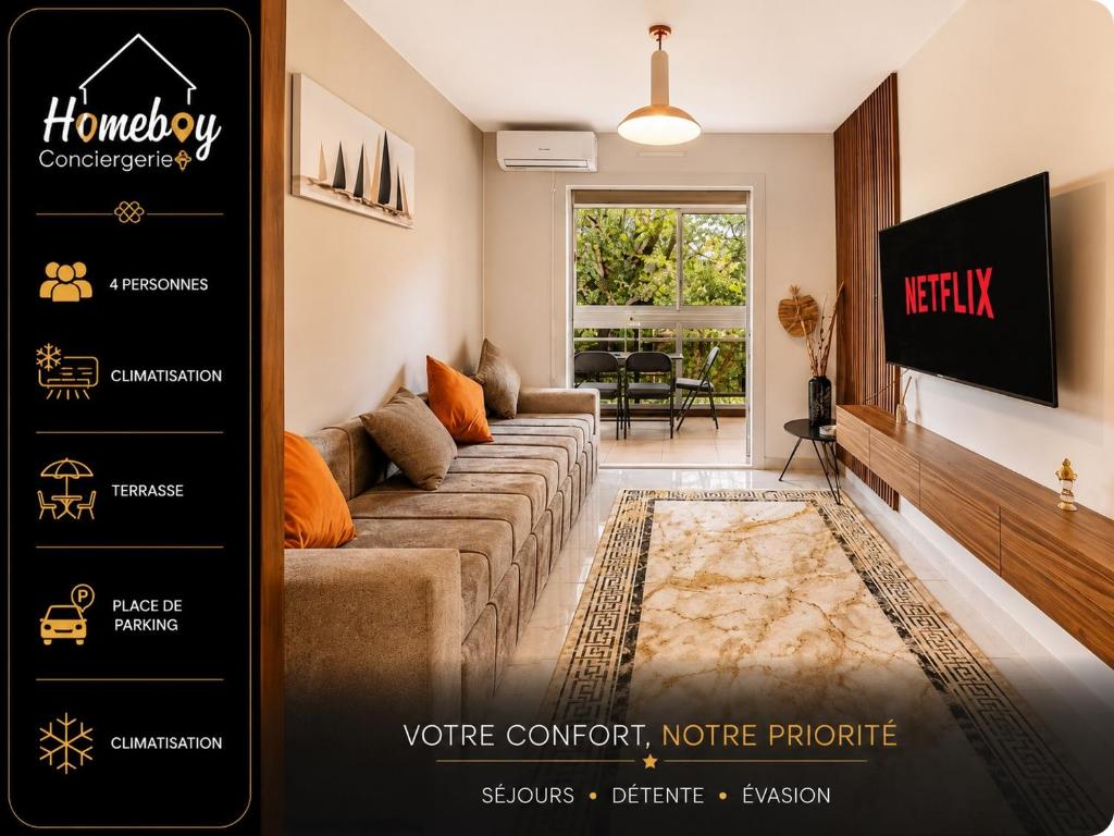 a living room with a couch and a tv at Les Jardins, Golfe-Juan in Vallauris