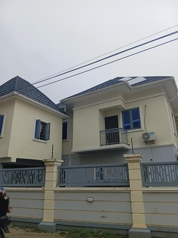 a house with a porch and a balcony at Soulluxury Apartment in Lekki