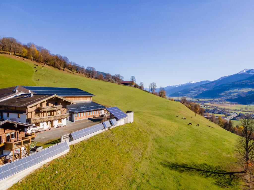 an aerial view of a house on a hill at Grünbichel Hof I in Uttendorf