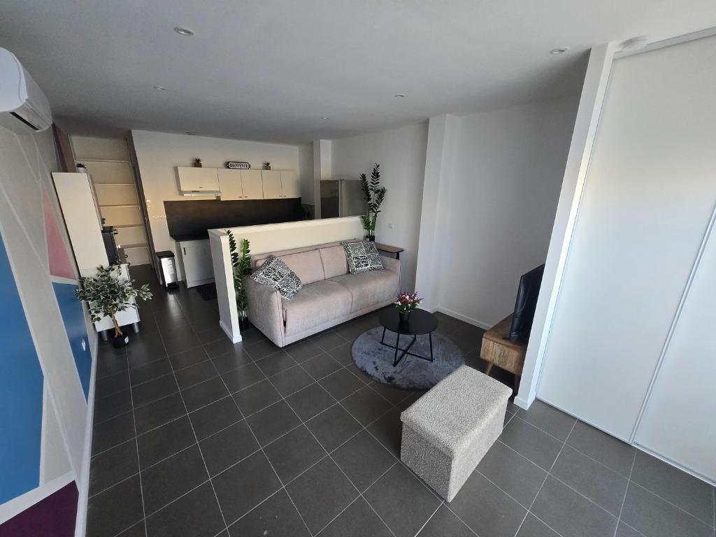 an aerial view of a living room with a couch at Le Canetois in Canet-en-Roussillon