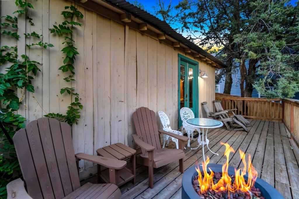 a patio with chairs and a table with a fire pit at Escape to Rustic Studio Fireplace Modern Comfort in Julian