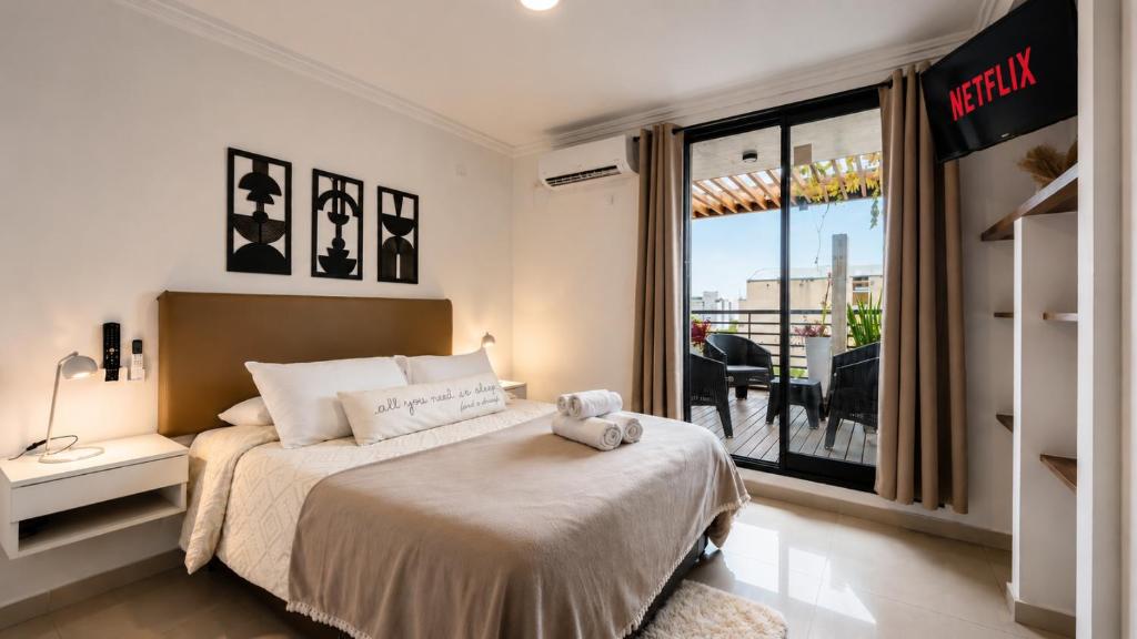 a bedroom with a bed with a teddy bear on it at "REFUGIO EN LA TERRAZA" - WiFi 300mbs in Santiago del Estero