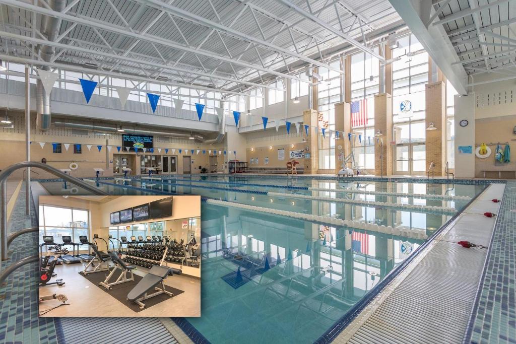 a large swimming pool in a large building at Bracken Lodge by Railey Vacations in Swanton