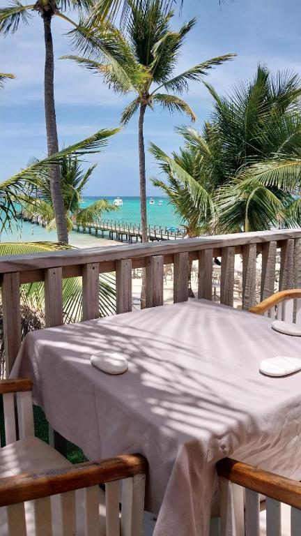 a table on a balcony with a view of the beach at Beach Pool Hotel Punta Cana in Punta Cana