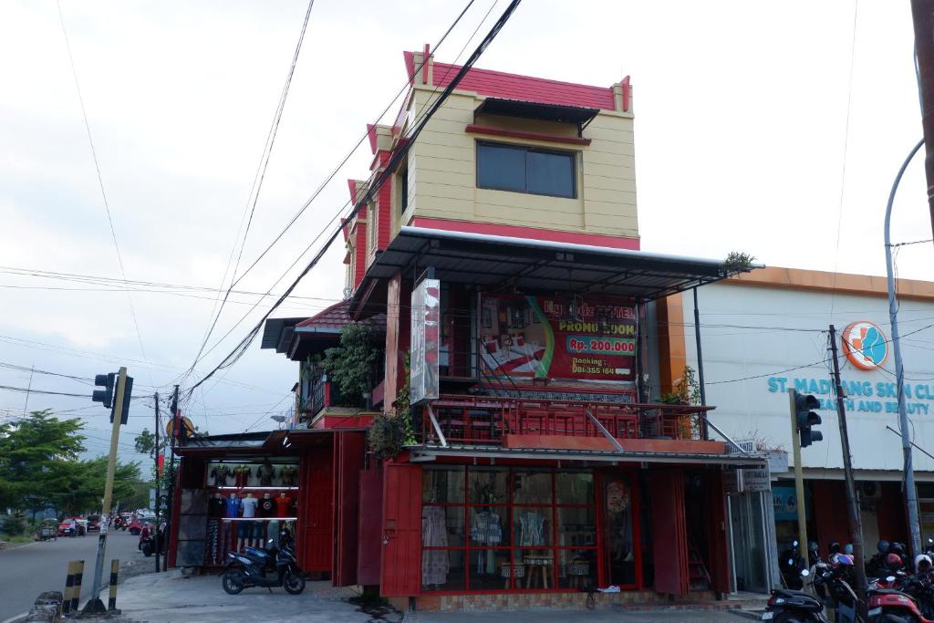 a building on the corner of a street at Hy ReDz in Palopo
