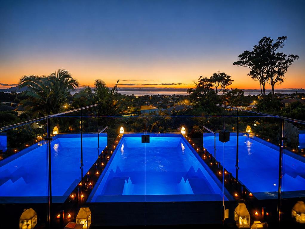 a view of a swimming pool at night at Ocean Outlook Retreat in River Heads