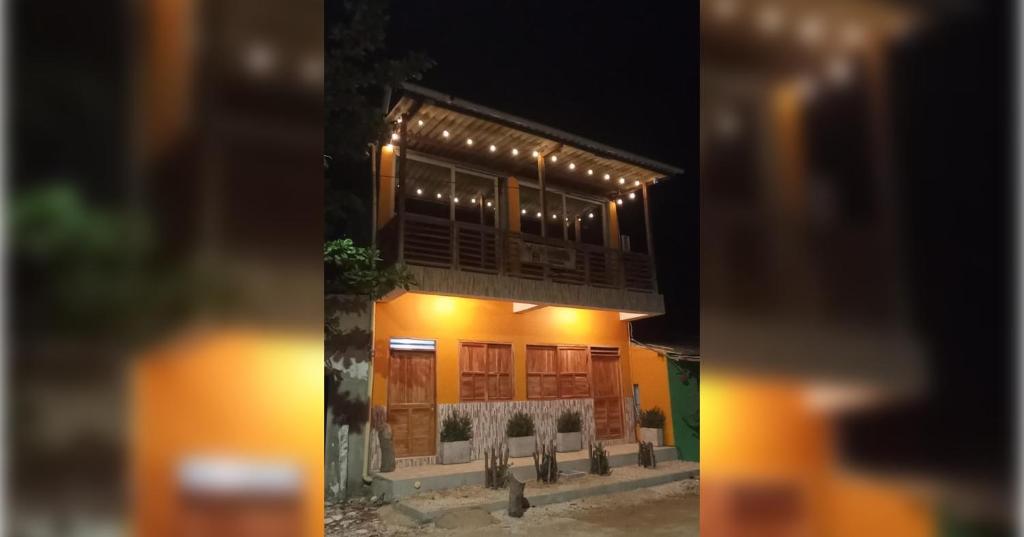 a building with lights on top of it at night at Casa Completa - Macondo Beach House in Rincón