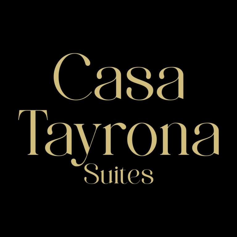 a group of gold text on a black background at Casa Tayrona Suites in Medellín