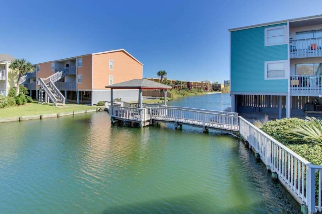 a view of a river with buildings and a dock at Villas on the Gulf K-2 in Pensacola Beach