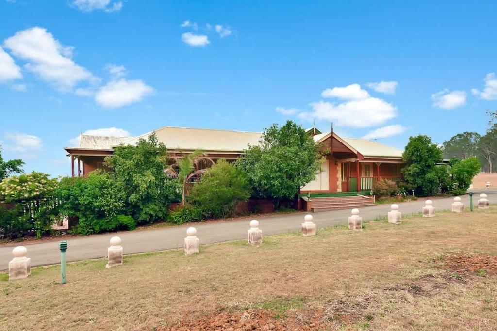 a building with a bunch of white statues in front of it at King 2 - close proximity to Bimbadgen and Hope Estate concerts in Pokolbin