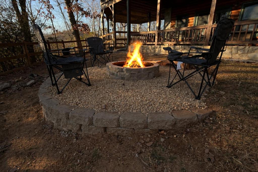 a fire pit in a yard with chairs and chairs around it at 4BR/3BA | Hot Tub | Pool Table | Views | Pets ok in Blue Ridge
