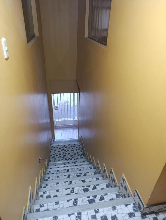 an empty room with a staircase with a window at Housing in Mancora in Máncora