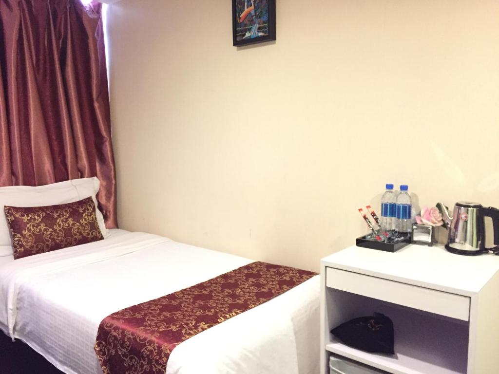 Postel nebo postele na pokoji v ubytování California Hotel