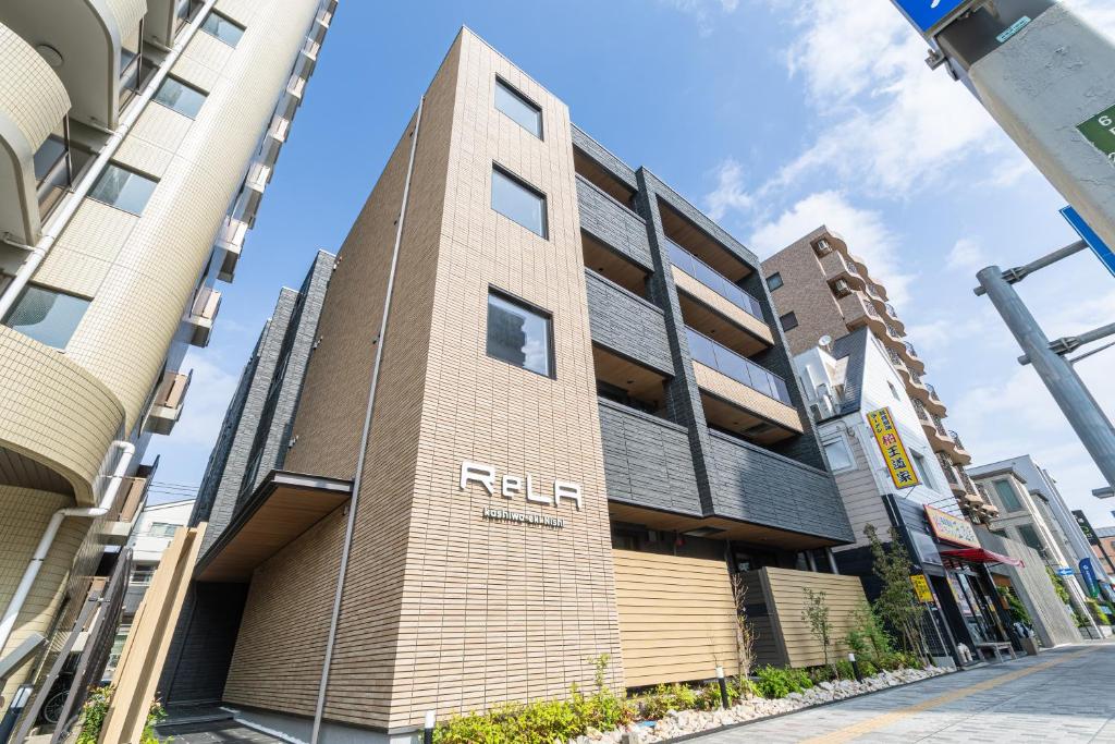 a building with the relta written on the side of it at ReLA Kashiwa Eki Nishi in Kashiwa