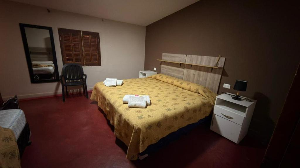 a bedroom with a bed with two towels on it at Cielo andino in Antofagasta de la Sierra