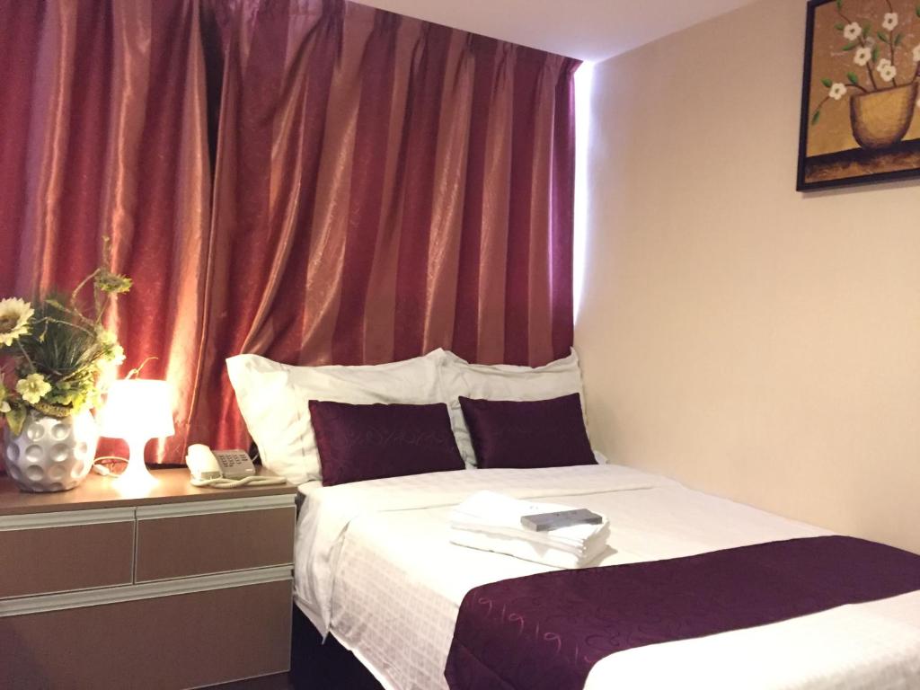 Postel nebo postele na pokoji v ubytování California Hotel