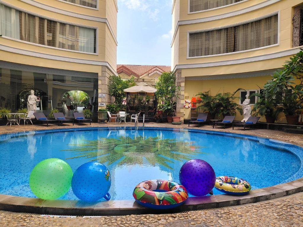 a pool with colorful balls in the middle of a building at Four Seasons Place Pattaya in Pattaya