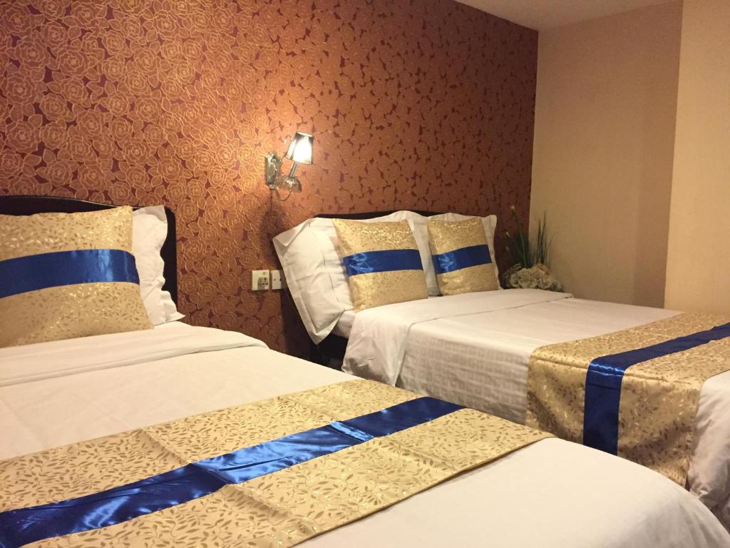 Postel nebo postele na pokoji v ubytování California Hotel