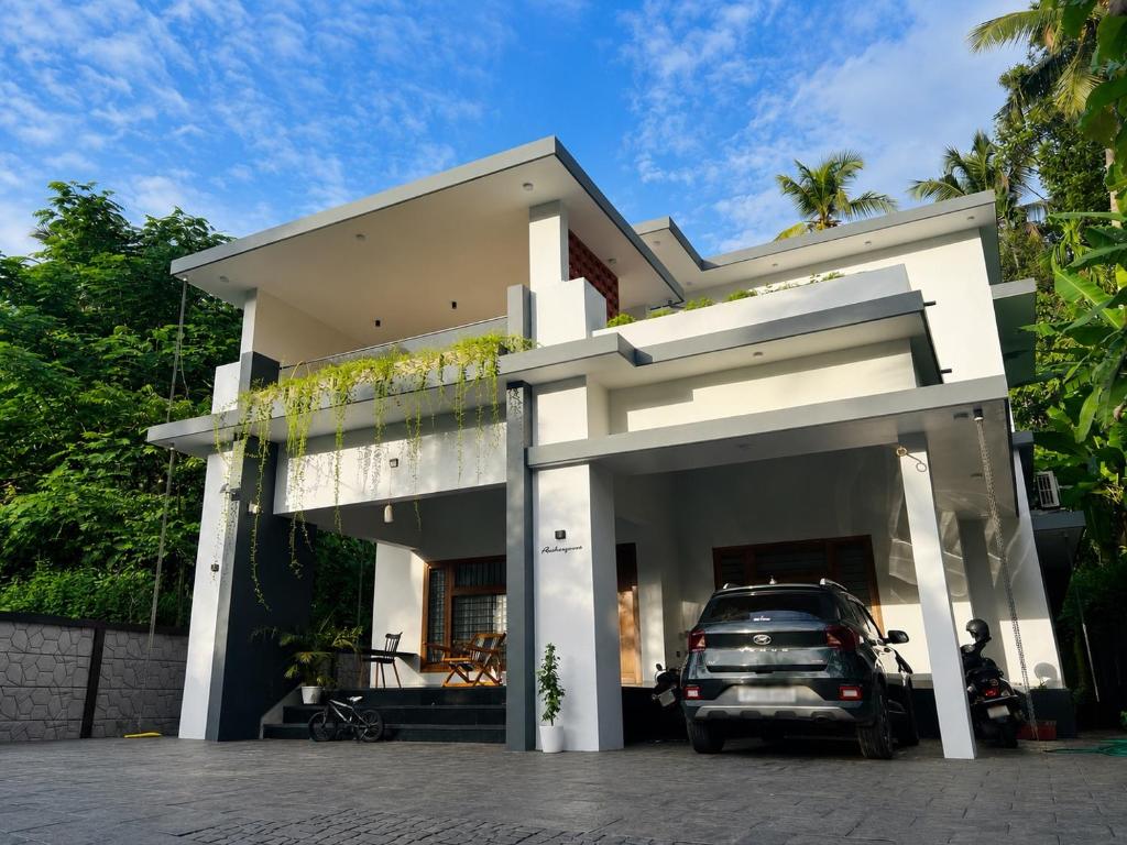 a car parked in front of a house at South Elegance in Tellicherry