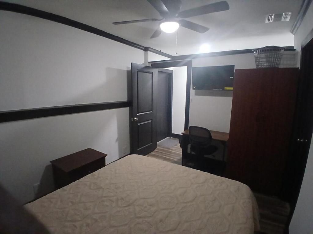 a bedroom with a bed and a ceiling fan at Cozy Retreat 1 Bed and Bath in San Antonio