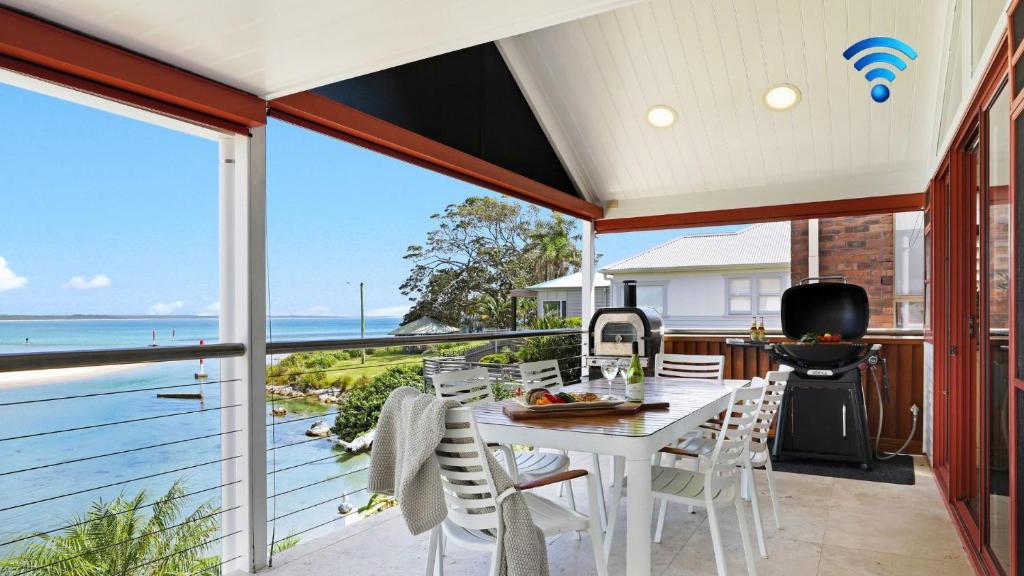 a dining room with a view of the ocean at Sea Light in Currarong