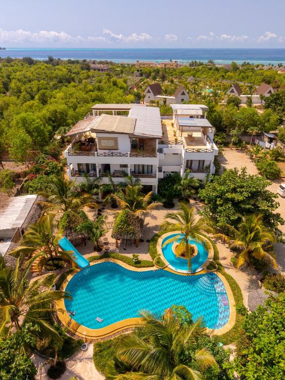 an aerial view of a resort with a swimming pool at Haber Hotel & SPA in Matemwe