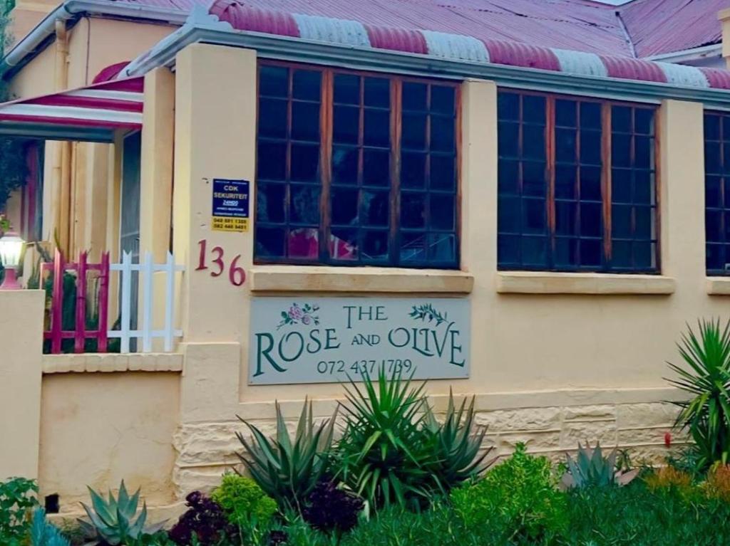 a house with a sign that reads the roose noveve off at The Rose and Olive in Cradock