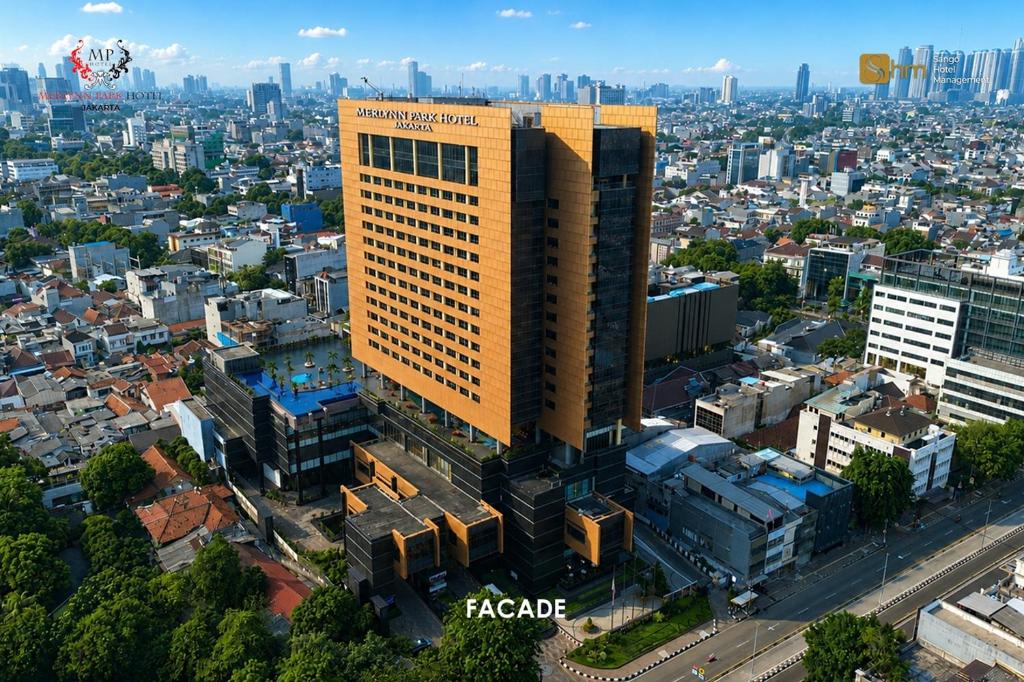 an overhead view of a tall building in a city at Merlynn Park Hotel in Jakarta