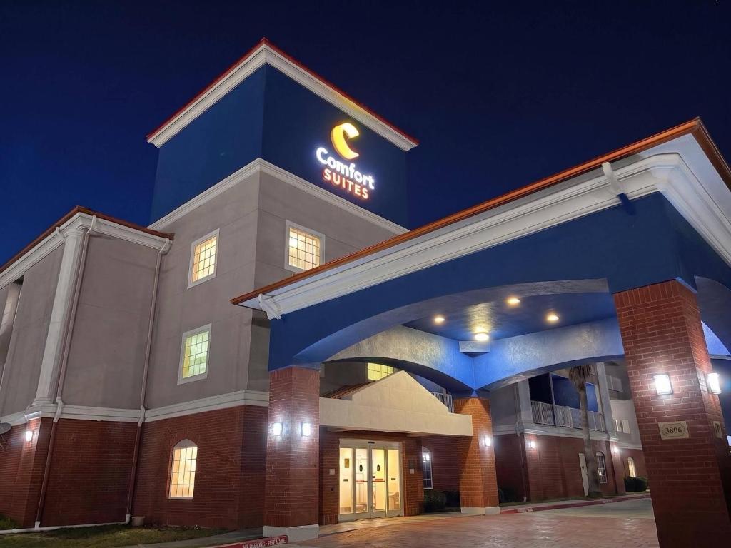 a building with a sign on top of it at Comfort Suites Galveston Cruise Port Area - Beachside in Galveston