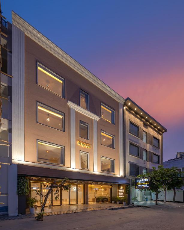 a rendering of a building at dusk at Perfectstayz Premium Vrindavan - Near Prem Mandir in Vrindāvan