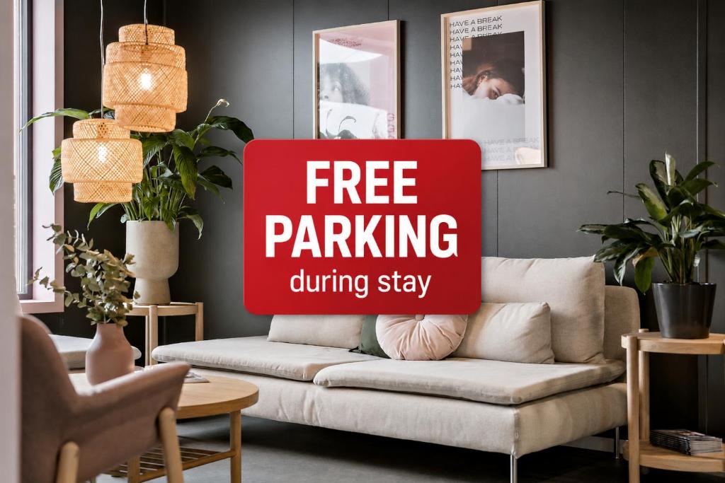 a free parking sign on a couch in a living room at Aiden by Best Western Herning in Herning