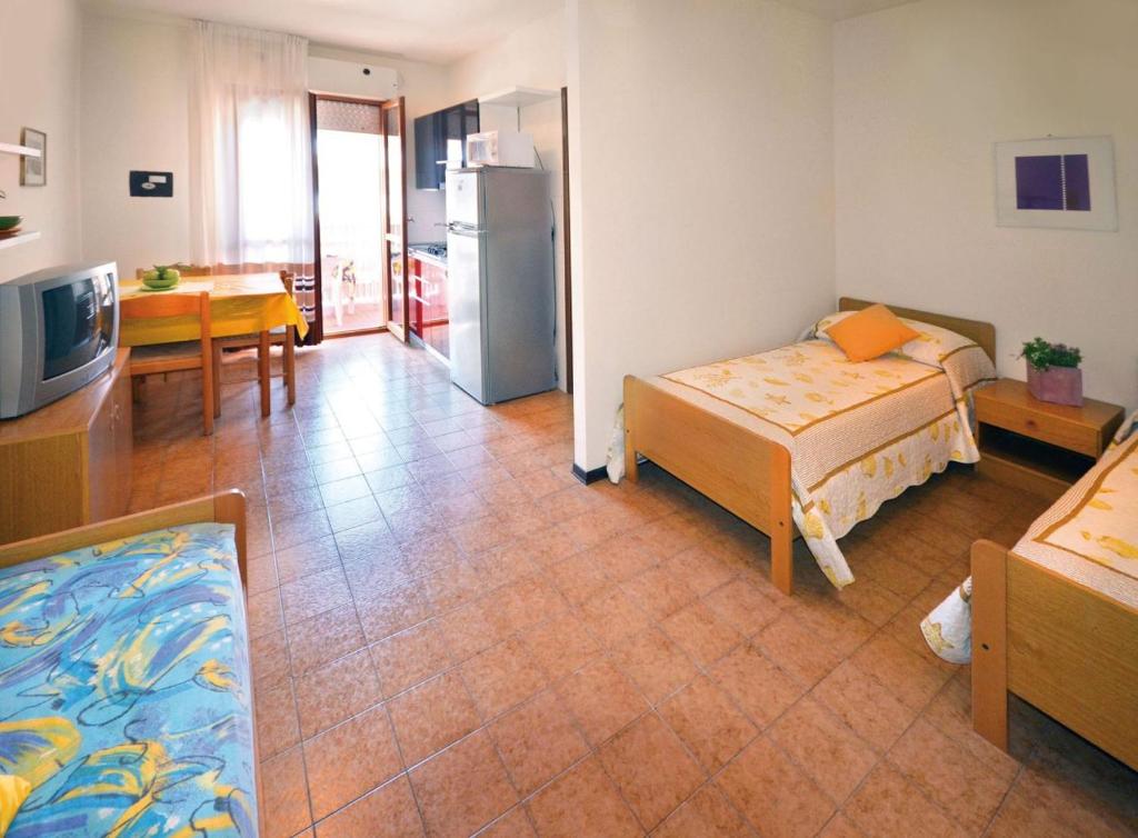 A bed or beds in a room at Residence Valbella